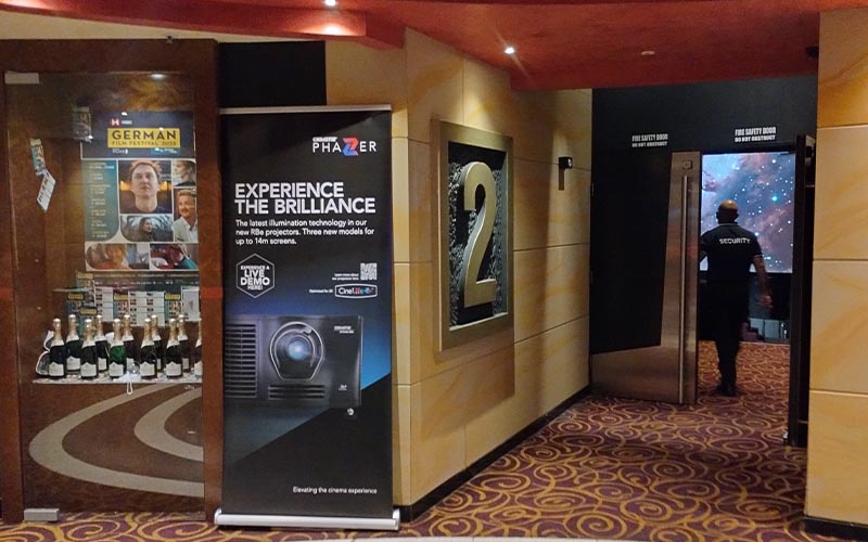 A Christie banner advertising a live demo of Christie Phazer